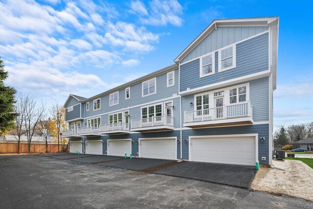 124 E Main St Unit 2-3, Cary, IL 60013 - view of front of home featuring a garage, board and batten siding, and driveway