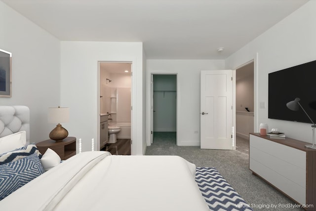 124 E Main St Unit 2-3, Cary, IL 60013 - bedroom with ensuite bathroom, carpet flooring, a walk in closet, a closet, and baseboards