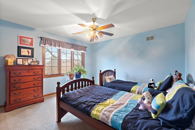 bedroom with a ceiling fan, baseboards, visible vents, and carpet flooring