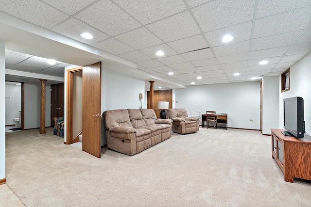 living area with ornate columns, recessed lighting, baseboards, and light colored carpet