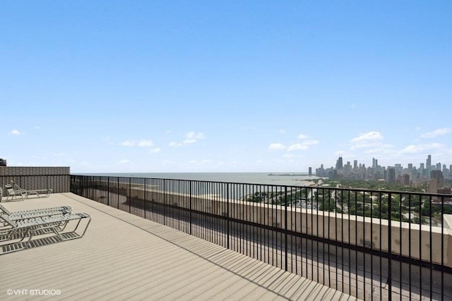 deck featuring a view of city and a water view