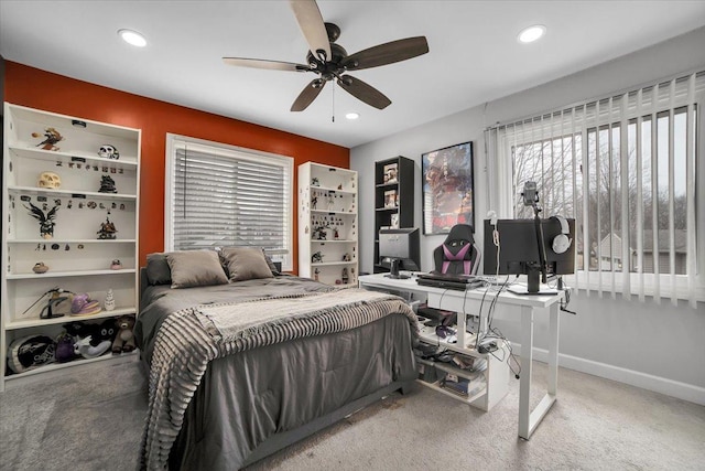 carpeted bedroom with ceiling fan, baseboards, and recessed lighting