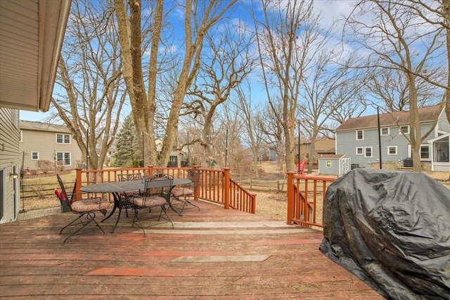 wooden deck featuring outdoor dining area