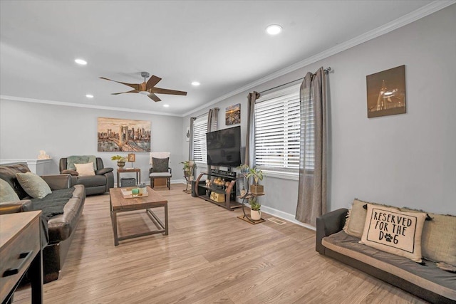 living room with crown molding, recessed lighting, baseboards, and light wood-style floors