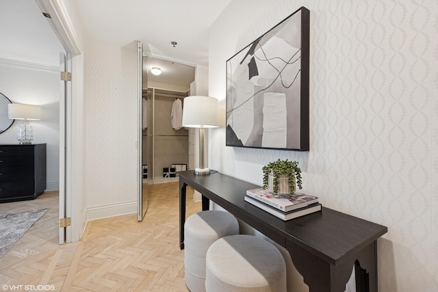 home office featuring baseboards and wallpapered walls