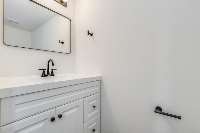 bathroom with vanity and visible vents