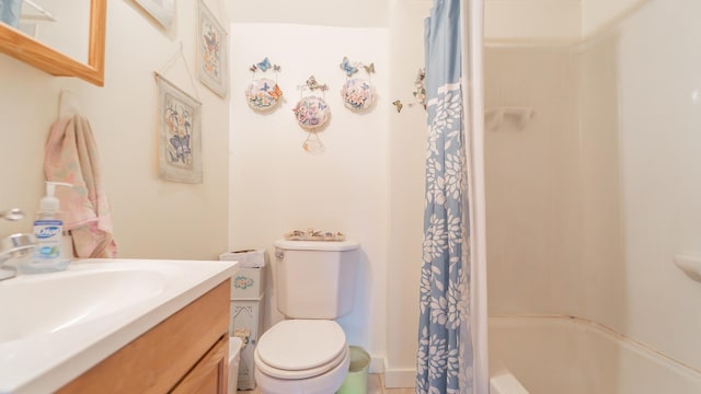 full bathroom with toilet and vanity