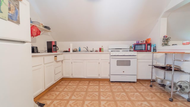 kitchen featuring light countertops, white appliances, open shelves, and white cabinetry