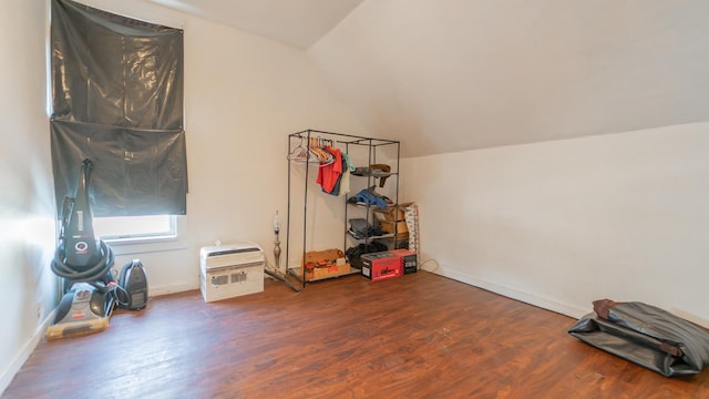 bonus room with vaulted ceiling, baseboards, and wood finished floors