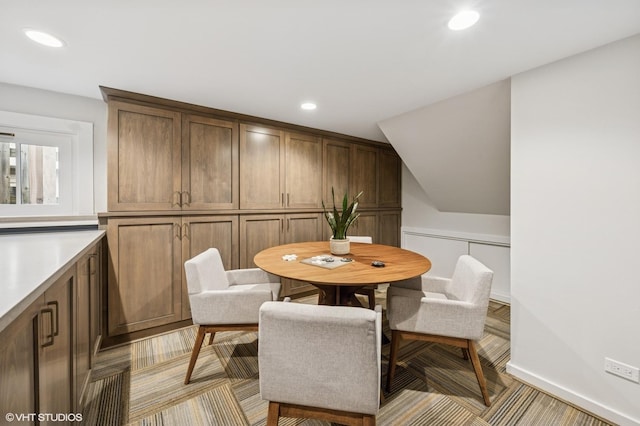 dining area featuring light carpet and recessed lighting