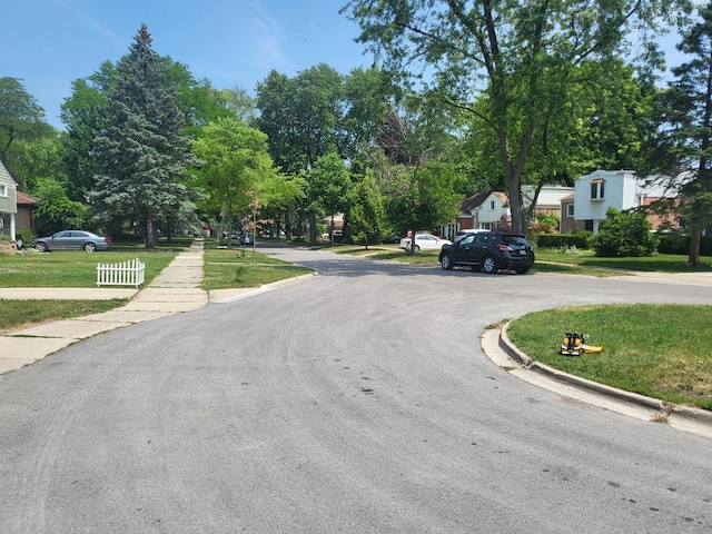 view of street with curbs