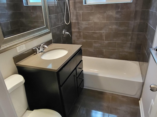 full bath with tile patterned flooring, a healthy amount of sunlight, vanity, and toilet