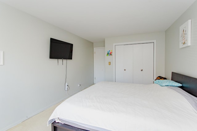 bedroom with a closet and carpet