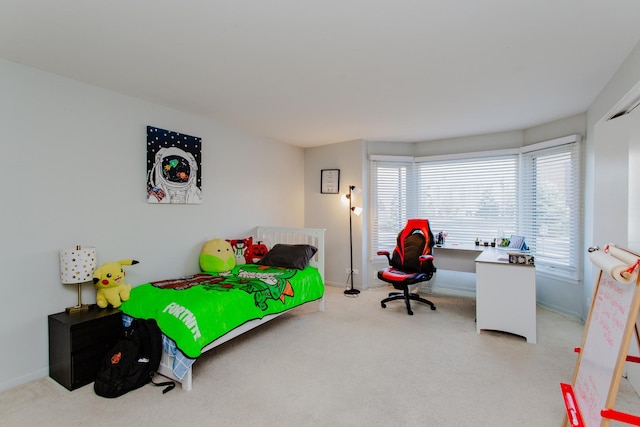 carpeted bedroom with baseboards