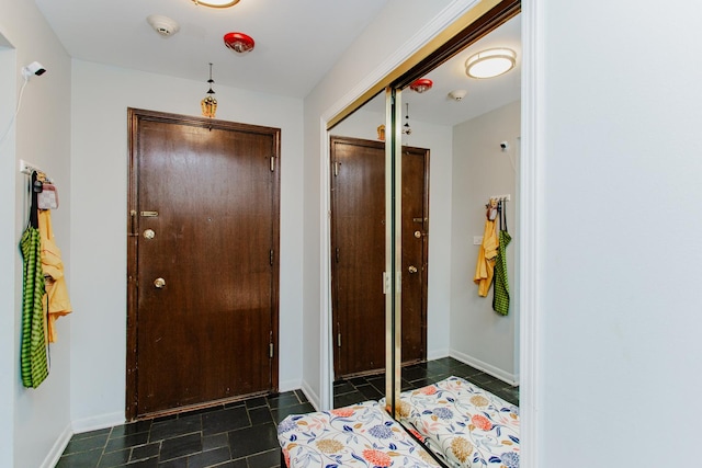 entryway featuring baseboards