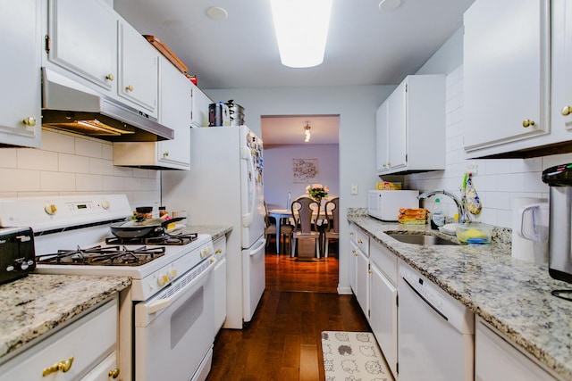 kitchen featuring dark wood-type flooring, under cabinet range hood, white cabinets, white appliances, and a sink