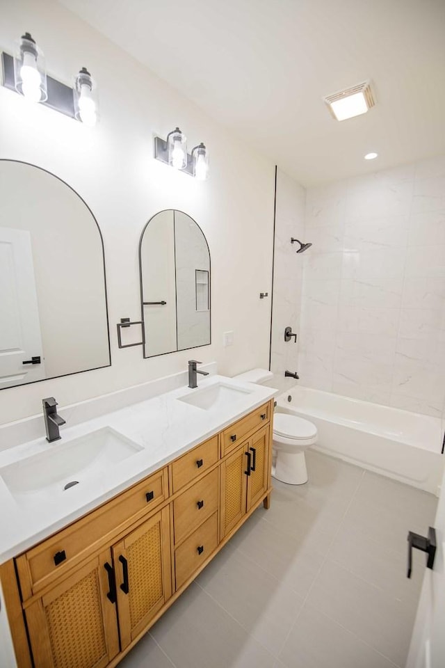 bathroom featuring  shower combination, a sink, toilet, and double vanity