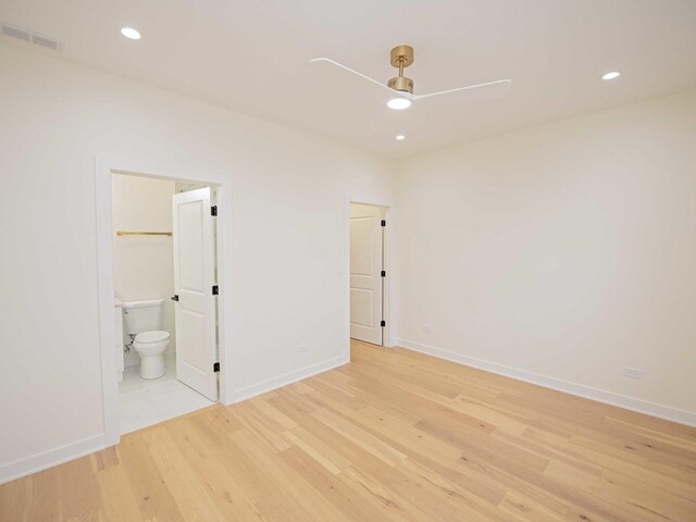 unfurnished bedroom featuring recessed lighting, visible vents, light wood-style floors, ensuite bath, and baseboards