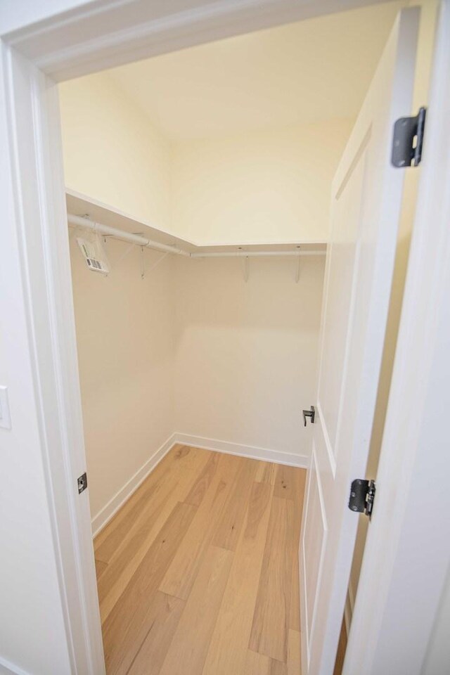 spacious closet with light wood-type flooring