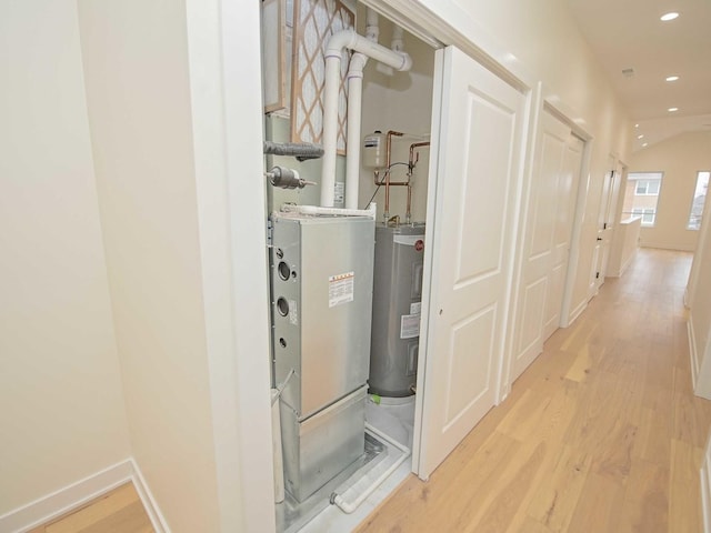 utility room with electric water heater