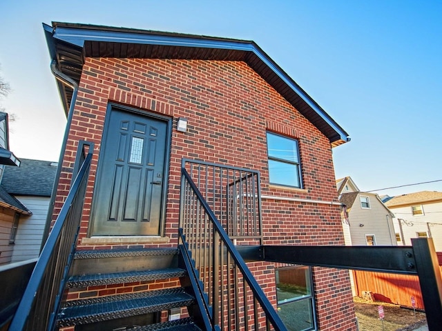 entrance to property with brick siding