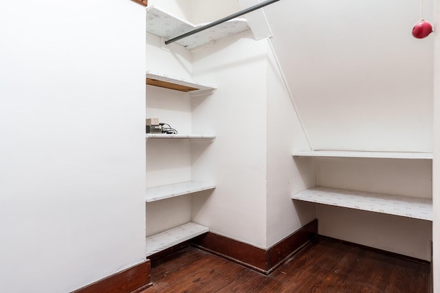 spacious closet featuring hardwood / wood-style floors