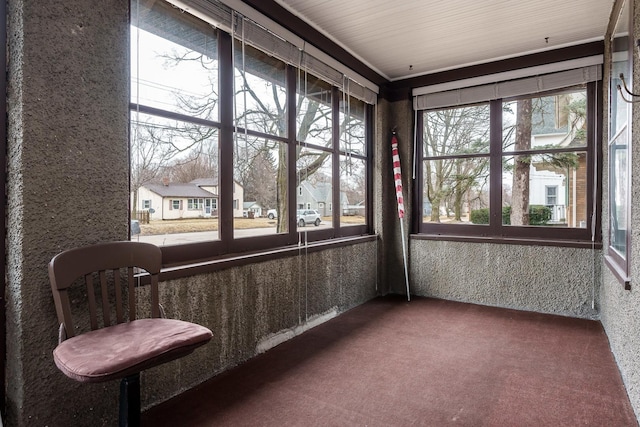 unfurnished sunroom featuring a residential view