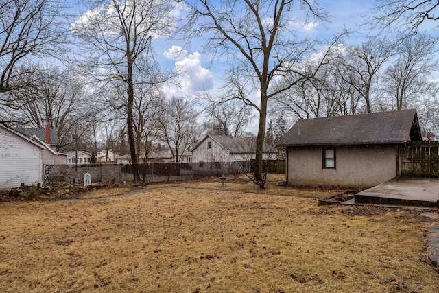 view of yard with an outbuilding and a fenced backyard