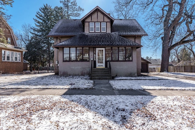 view of front of house featuring fence and stucco siding