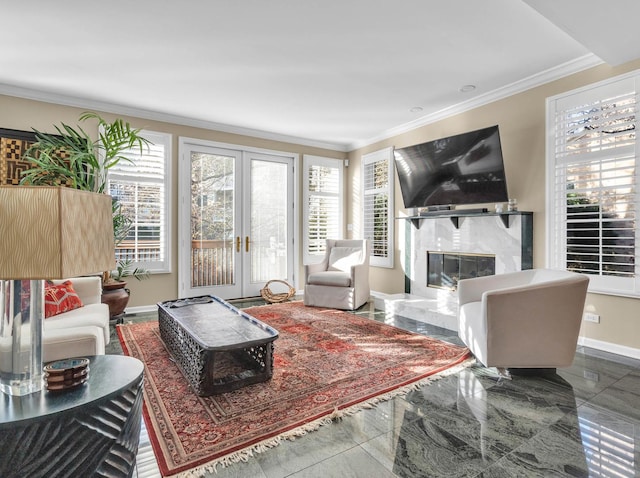 living room featuring french doors, marble finish floor, crown molding, a premium fireplace, and baseboards