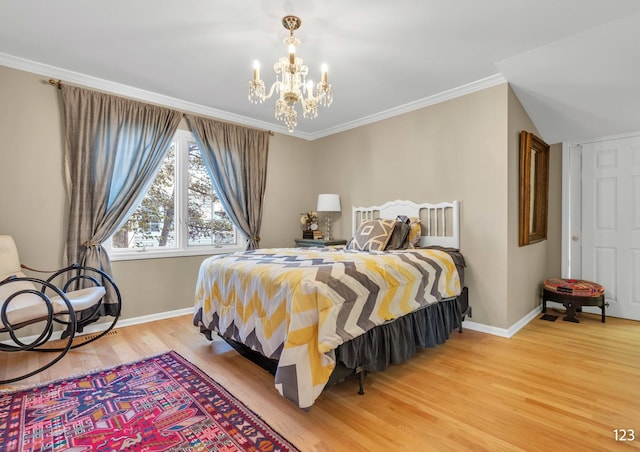 bedroom with baseboards, crown molding, light wood finished floors, and an inviting chandelier