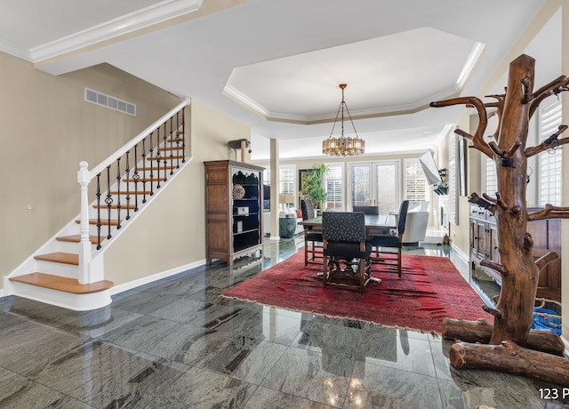 dining space featuring a raised ceiling, visible vents, plenty of natural light, and stairway