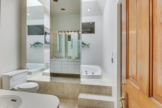 full bath with toilet, a garden tub, and vanity