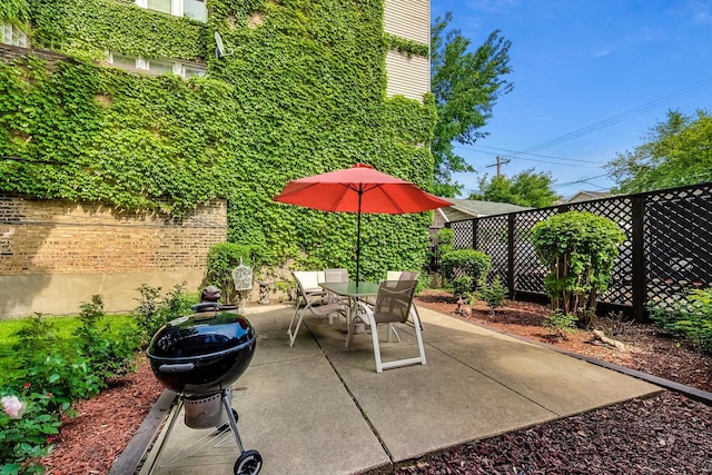 view of patio / terrace with outdoor dining space and a fenced backyard