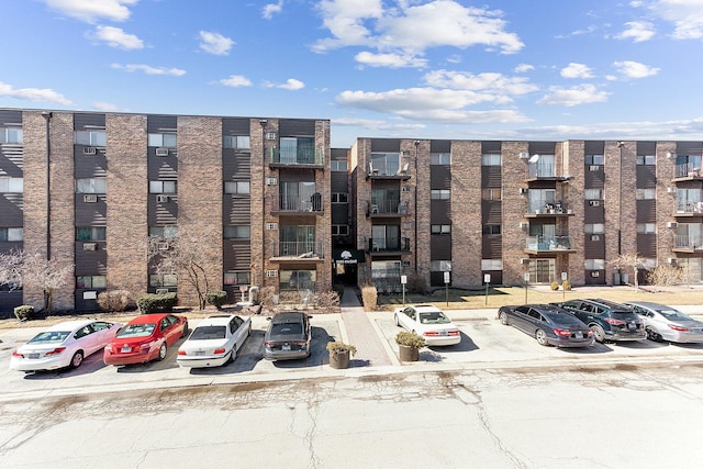 view of property featuring uncovered parking