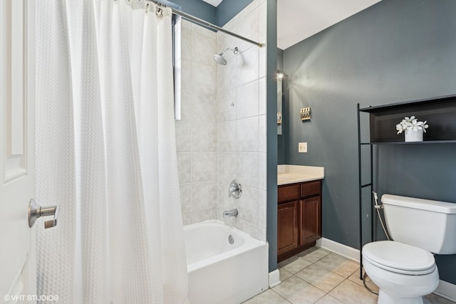 bathroom featuring baseboards, toilet, shower / tub combo with curtain, tile patterned flooring, and vanity