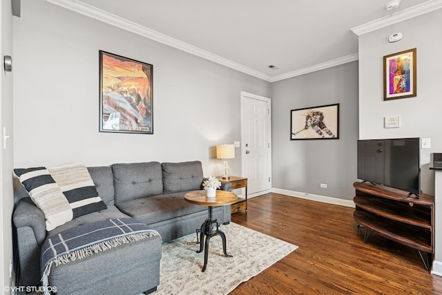 living area with crown molding, visible vents, dark wood finished floors, and baseboards