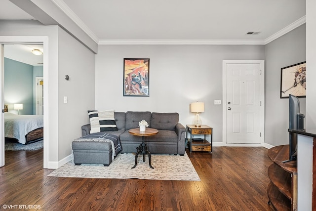 living area with dark wood-style floors, visible vents, baseboards, and crown molding