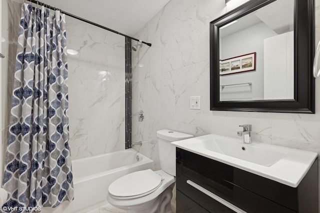 full bath with marble finish floor, tile walls, shower / bath combination with curtain, toilet, and vanity