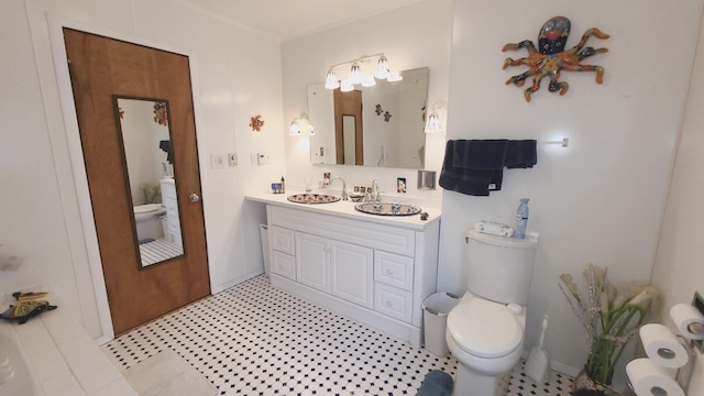 bathroom with toilet and vanity