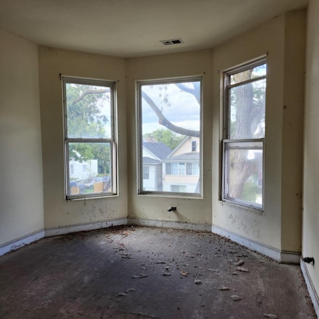 spare room featuring visible vents