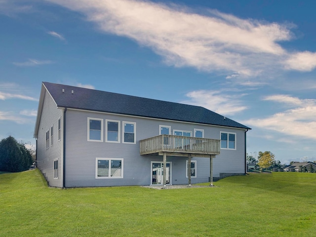 back of property with a deck and a lawn