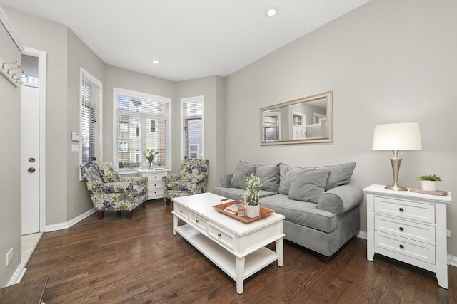 living room featuring recessed lighting, baseboards, and dark wood finished floors