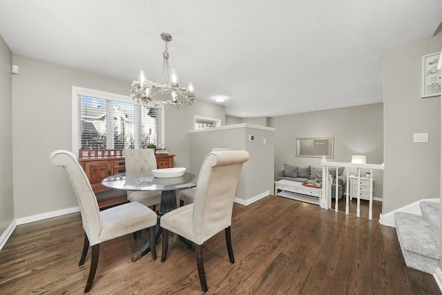 dining area with stairway, wood finished floors, baseboards, and a chandelier