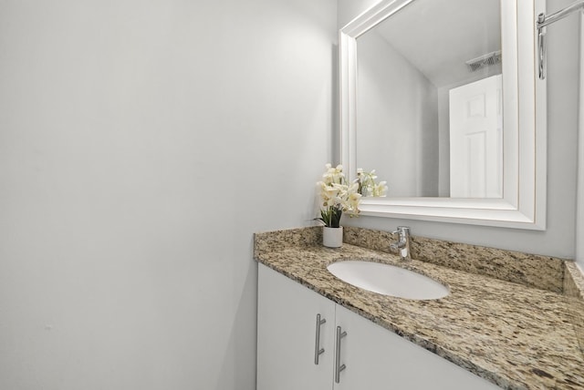 bathroom featuring visible vents and vanity