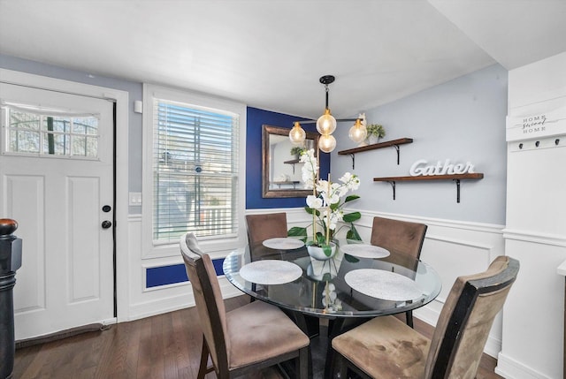 dining room with wood finished floors and wainscoting