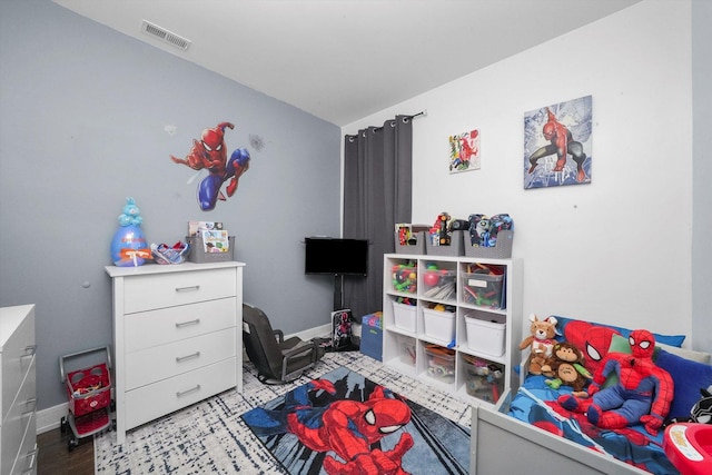 bedroom with visible vents and baseboards