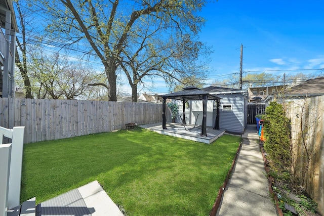 view of yard featuring a gazebo and a fenced backyard