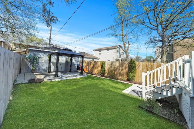 view of yard featuring a patio area, a fenced backyard, and a gazebo