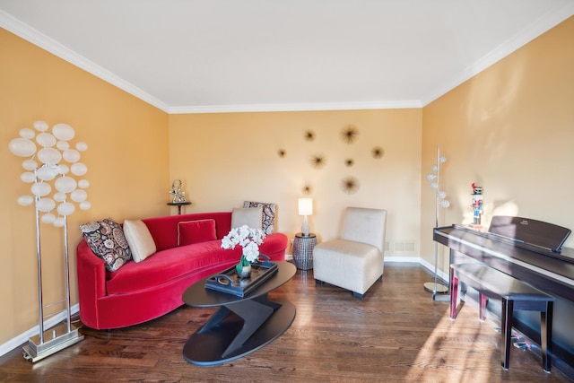 living room with baseboards, wood finished floors, visible vents, and crown molding